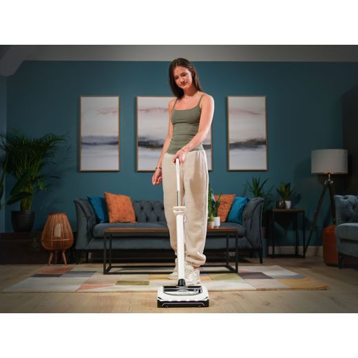 Gtech AirRam Platinum 1-03-273 Cordless Vacuum Cleaner with up to 60 Minutes Run Time - Silver - Women hoovering floor shot