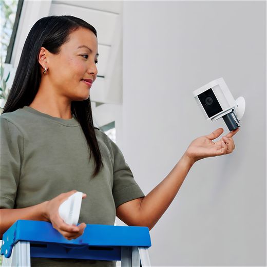 Ring Battery Powered Spotlight Cam Plus Full HD 1080p Smart Home Security Camera - Black - Women changing battery in ring camera shot