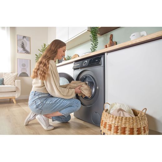 Bosch Series 6 i-Dos WGH254ARGB 10kg WiFi Connected Washing Machine with 1400 rpm - Graphite - women loading machine shot