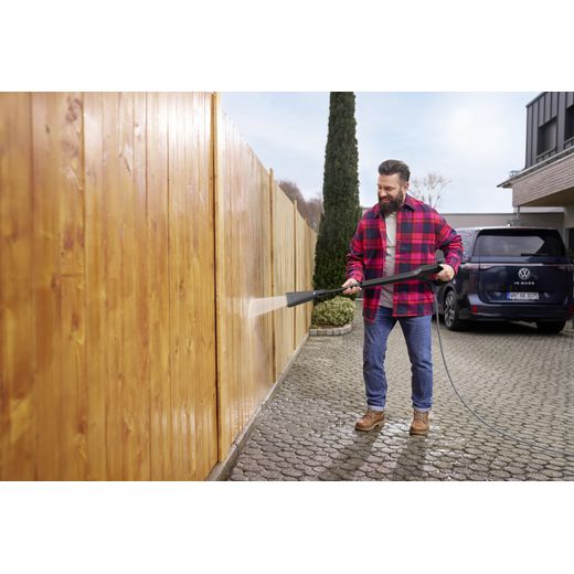 Kärcher K 5 WCM Flex eco!Booster Pressure Washer - Man cleaning fence