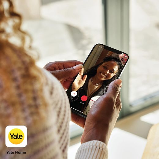 Yale Video Smart Doorbell - - Black SKU: SV-VDB-1A-W - Women using phone app shot