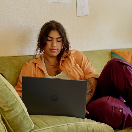 HP 15-fd0062na 15.6" Laptop - Intel® Core™ i5, 512GB SSD, 8 GB RAM - Jet Black - person on sofa with laptop shot