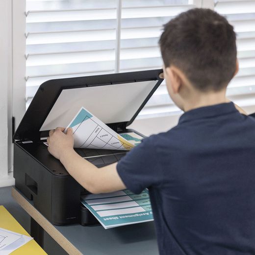Brother DCP-T580DW 3-in-1 Compact Inkjet Printer - Black - Person using printer scanner shot