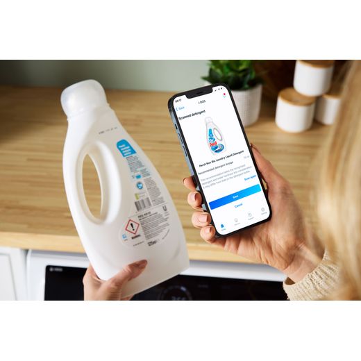 Bosch Series 8 i-Dos 10.5Kg / 6Kg Washer Dryer - White - Women using phone to check cleaning solution shot