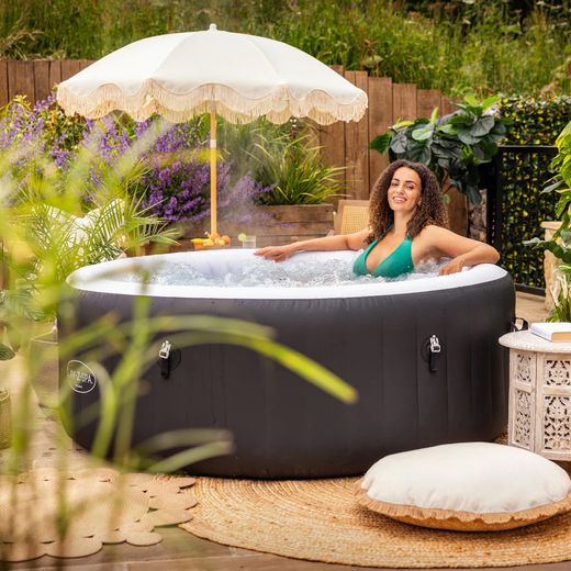 Lay-Z-Spa Miami AirJet™ BW60001GB Hot Water Dispenser - Black - Hot tub in garden shot
