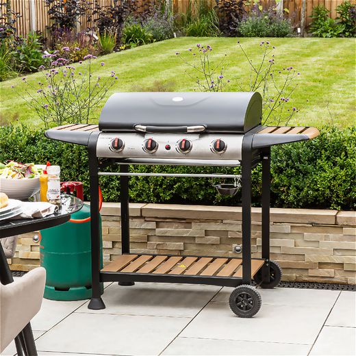 George Foreman 4 Burner Gas Barbeque - Black / Wood - BBQ in garden shot