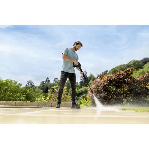 Kärcher K 4 WCM Flex eco!Booster Car & Home Pressure Washer - Man cleaning flags