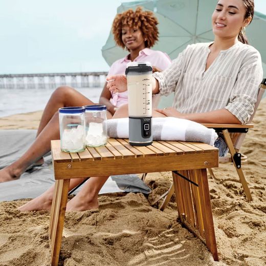Ninja Blast BC151UKBK Portable Blender - Black - Woman using blender on beach