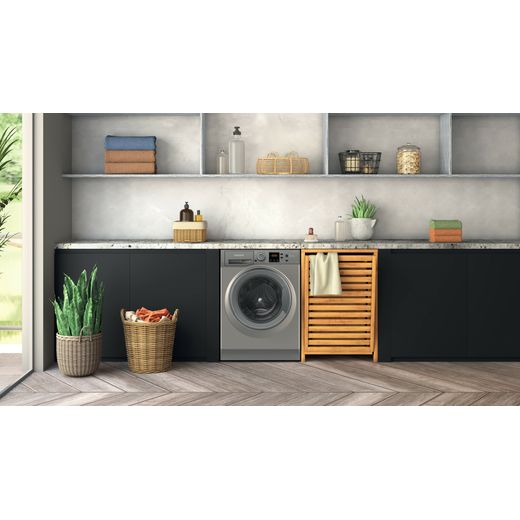 Hotpoint Anti-Stain NSWM 7469 GG UK 7kg Washing Machine with 1400 rpm - Graphite - Washing machine in utility room shot