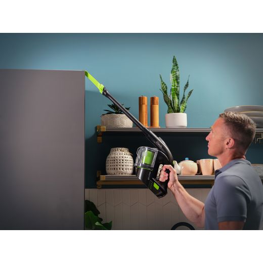 Gtech Multi K9 1-03-195 Cordless Vacuum Cleaner with up to 20 Minutes Run Time - pixel - Man hoovering top of fridge