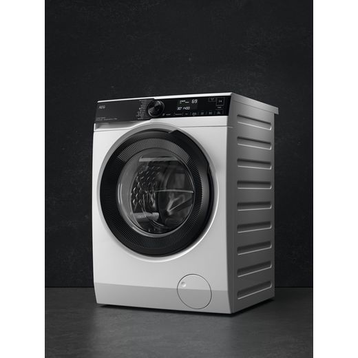 AEG 7000 ProSteam® LFSR7414U6UD 10kg Washing Machine with 1400 rpm - Dark Silver - Washing machine in room shot