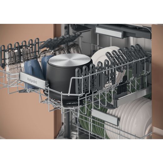 Hotpoint Fully Integrated Standard Dishwasher - Stainless Steel - Top tray open in dishwasher shot