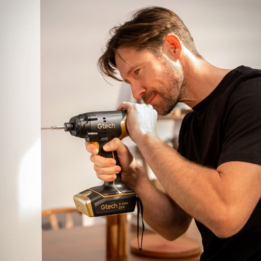 Gtech 1-12-031 Tool Black / Gold - Man using drill
