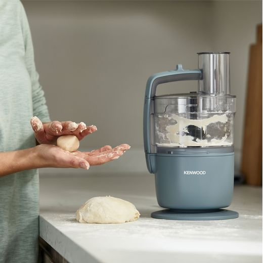 Kenwood - Grey - Person rolling dough from processor shot