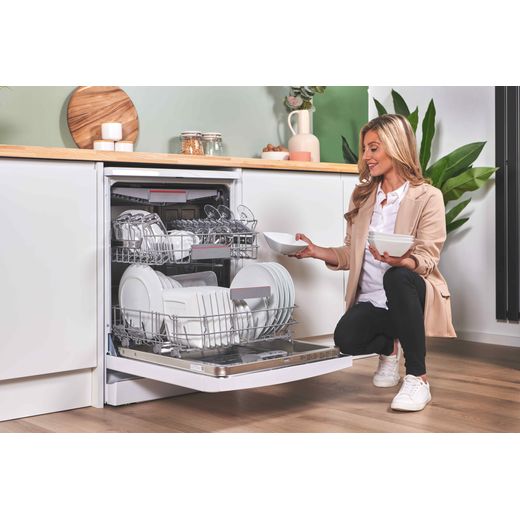 Bosch Series 6 Standard Dishwasher - White - Woman filling dishwasher racks