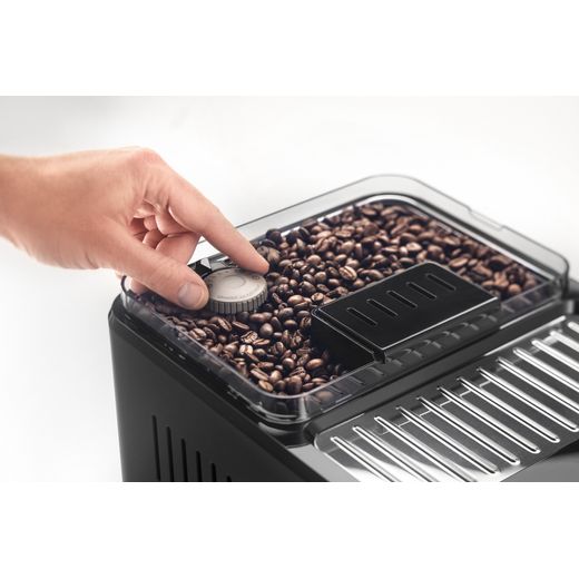 De'Longhi Eletta Explore ECAM450.86.T Bean to Cup Coffee Machine - Black - Person turning setting for coffee beans shot