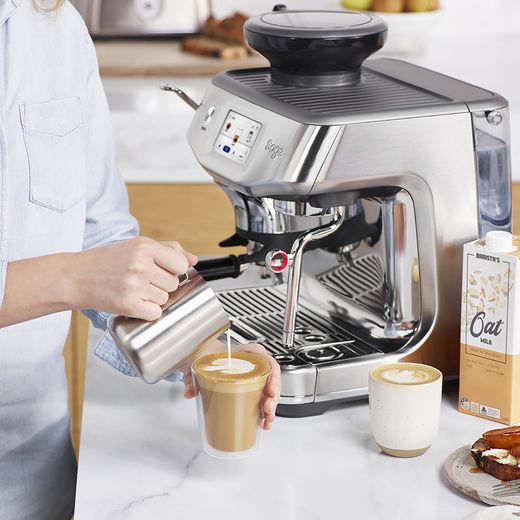 Sage The Barista Touch™ Impress with Cold Brew Espresso Coffee Machine - Stainless Steel - Pouring milk into coffee