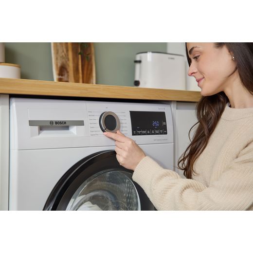 Bosch Series 6 WQG24502GB 9Kg Heat Pump Tumble Dryer - White - women with control panel shot