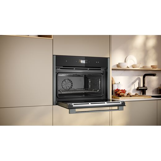NEFF N90 Compact Electric Single Oven - Graphite - Oven in kitchen with door open shot