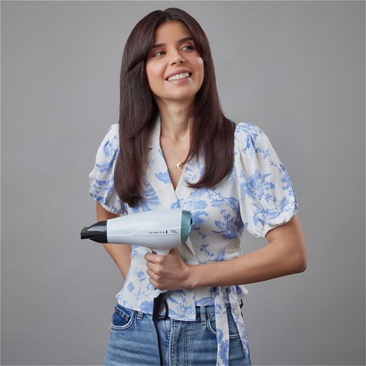 Remington Shine Therapy Hair Dryer With 2 Accessories - White - Women holding hairdryer shot
