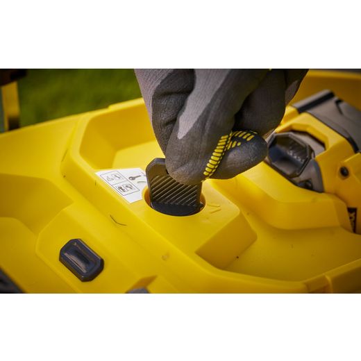 Stanley Fatmax V20 Cordless Lawn Mower - lifestyle - hand putting lock on