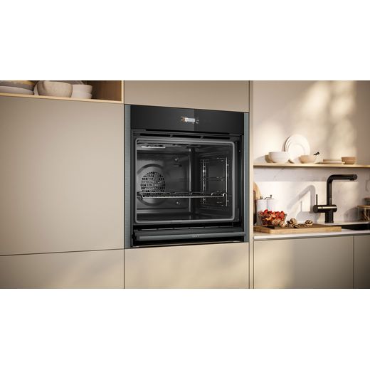 NEFF N70 Slide & Hide® Built In Electric Single Oven - Graphite -  Oven in kitchen door open shot