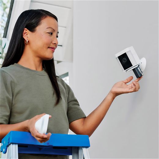 Ring Battery Powered Spotlight Cam Plus Full HD 1080p Smart Home Security Camera - White - Women changing battery in camera shot