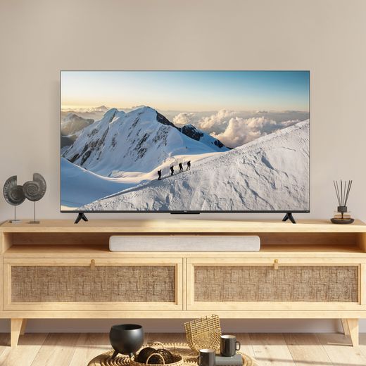 TCL 43" 4K Ultra HD Smart Fire TV [2026] - 43V6D-UK - lifestyle - fromnt shot of TV in living room showing people hiking up a snowy mountain