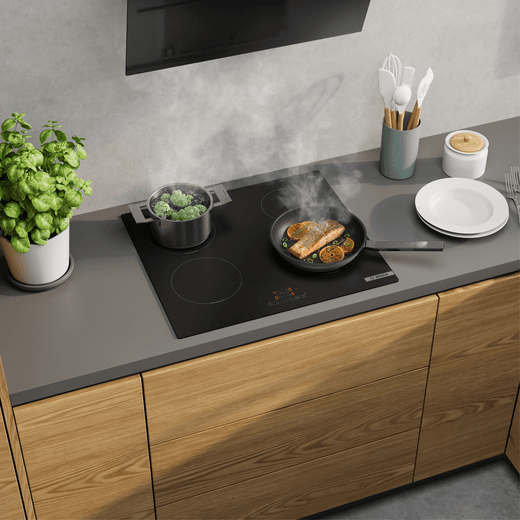 Bosch Series 4 PIE61ABB5E 59cm Induction Hob - - lifestyle - top angled view of hob in kitchen cooking food