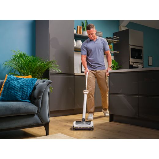 Gtech AirRam Platinum 1-03-273 Cordless Vacuum Cleaner with up to 60 Minutes Run Time - Silver - Man hoovering floor shot