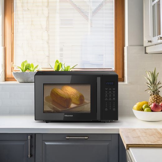 Hisense H29MOBS9HGUK 29 Litre Microwave With Grill - Black - Microwave in kitchen with food inside