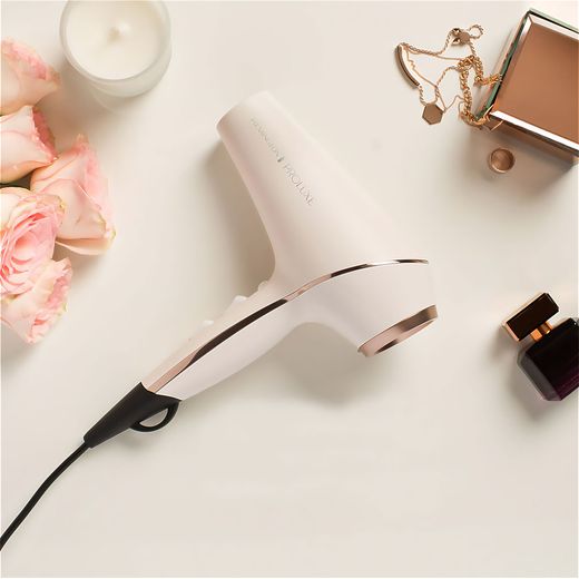 Remington PROluxe Hair Dryer With 3 Accessories - White / Rose Gold - hairdryer on table shot