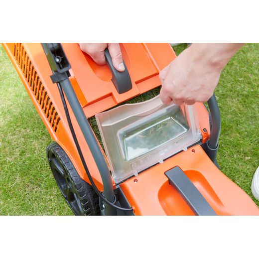 Flymo SimpliMow 320V Corded Lawn Mower - Orange - person emptying grass shot
