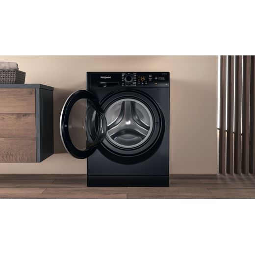 Hotpoint Anti-Stain NSWM 846 BS UK 8kg Washing Machine with 1400 rpm - Black - Washing machine in utility room shot