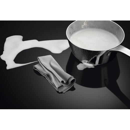 AEG SurroundCook Electric Cooker with - Black - Hob with spilled milk on hob shot