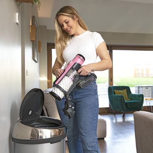 916116_PI - Women putting rubbish in bin shot
