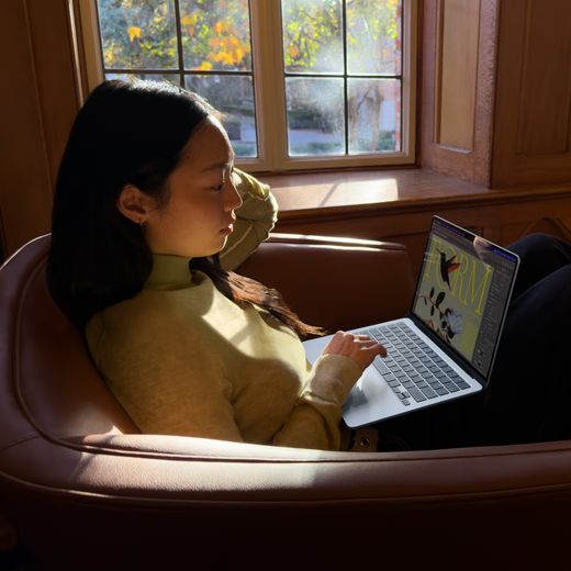 Apple MacBook Air, - Silver - person using laptop