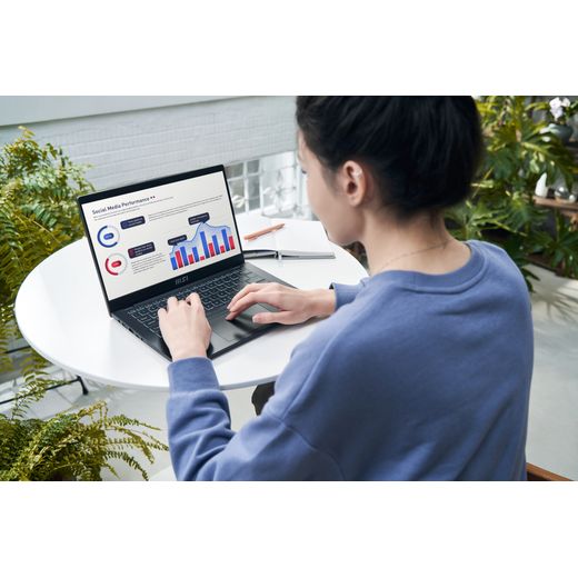 MSI Modern 14 C7M-407UK 14" Laptop - AMD Ryzen™ 5, 512GB SSD, 8 GB RAM - Black - Woman using laptop