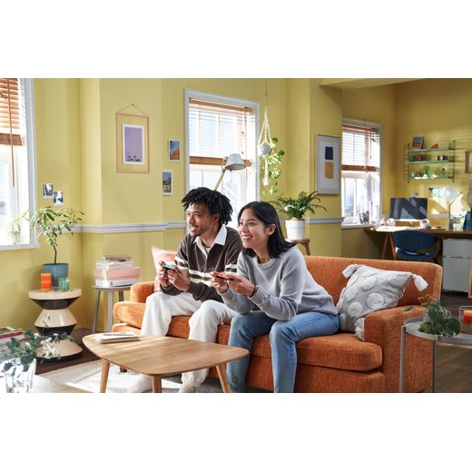 Nintendo Switch 2 Console - Man and woman on couch gaming