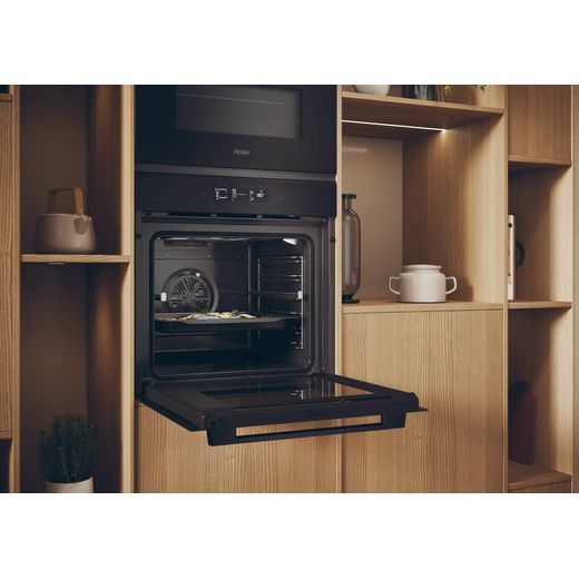 Haier Built In Electric Single Oven - Black  - Oven in kitchen with door open shot