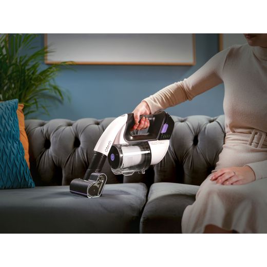 Gtech Multi Platinum 1-03-274 Cordless Vacuum Cleaner with up to 30 Minutes Run Time - Silver / Black - Women hoovering sofa shot