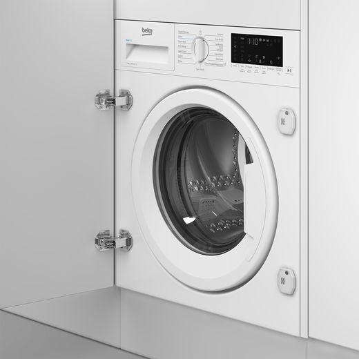 Beko RecycledTub® WTIK94121F Integrated 9kg Washing Machine with 1400 rpm - White - Washing machine in cupboard shot