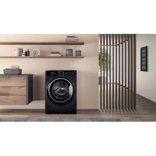 Hotpoint Anti-Stain NSWM 846 BS UK 8kg Washing Machine with 1400 rpm - Black - Washing machine in utility room shot