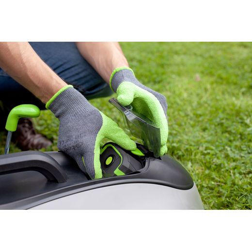 Gtech 1-05-020 Lawn Mower Green / White - Man putting battery in lawnmower shot