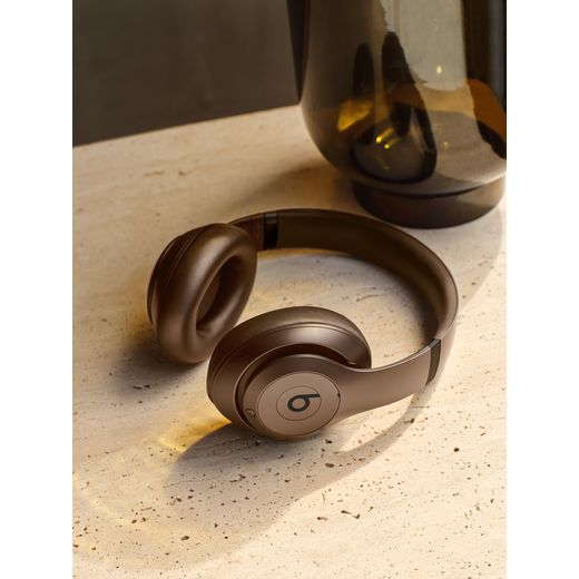 Beats Headphones - Deep Brown - Headphones lying on table shot