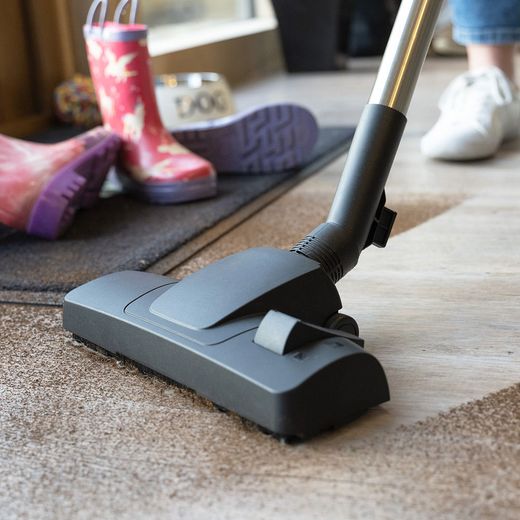 Henry Xtra HVX160-11 Cylinder Vacuum Cleaner - person cleaning floor shot