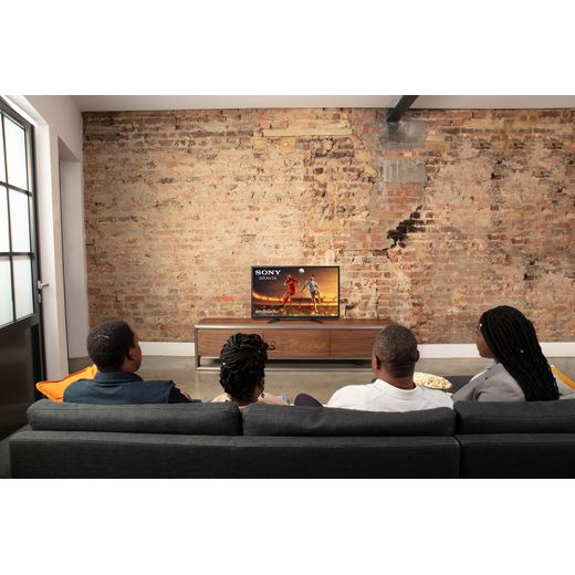 Sony Bravia W800 32" 720p HD Ready Smart Android TV - People sat on sofa watching tv shot