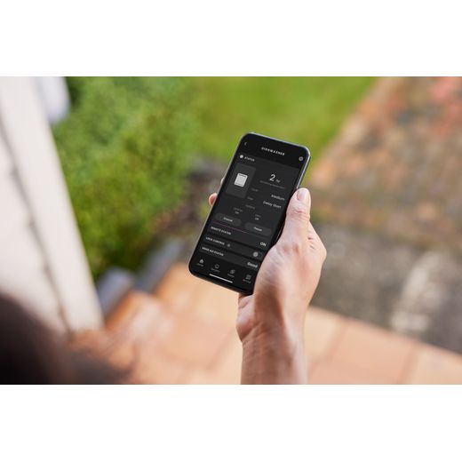 Fisher & Paykel Series 9 Fully Integrated Standard Dishwasher - Black with Fixed Door Hinge Kit - Person using connected app