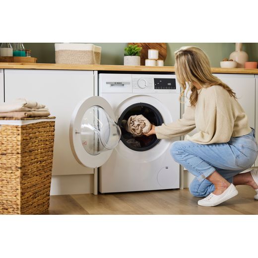 Bosch Series 4 9Kg / 5Kg Washer Dryer - White - Women filling machine shot