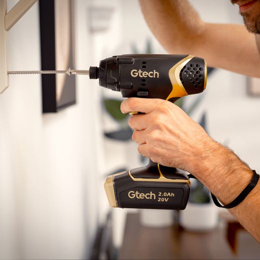 Gtech 1-12-031 Tool Black / Gold - Person using drill